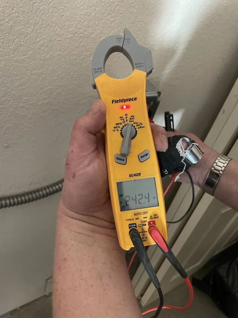 Voltage testing with clamp meter during Aluminum Wiring Replacement in Big Rapids